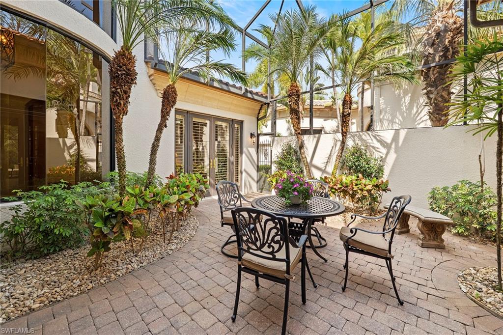 18071 Lagos Way Naples, FL 34110 - Photo 4 of 44 a view of a house with backyard and sitting area
