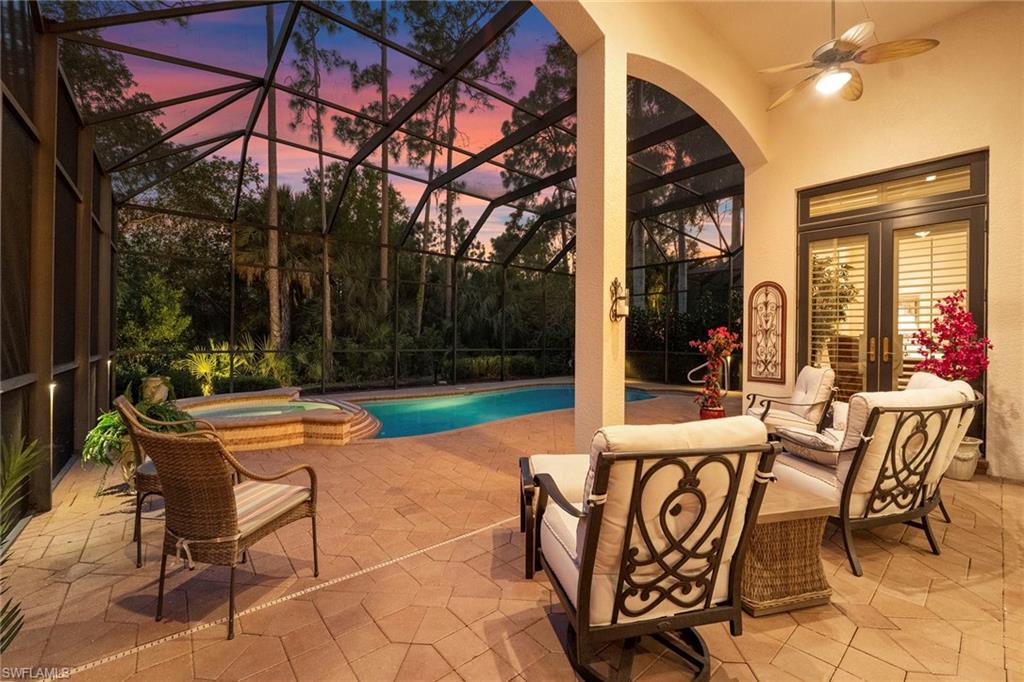 18071 Lagos Way Naples, FL 34110 - Photo 42 of 44 a view of a patio with a table and chairs