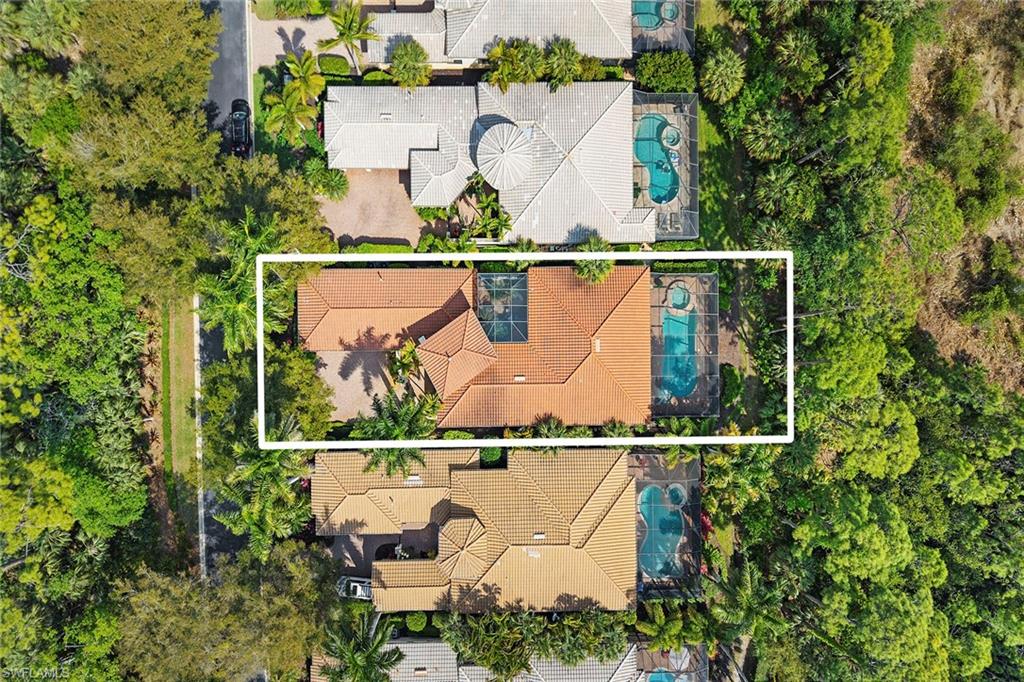 18071 Lagos Way Naples, FL 34110 - Photo 9 of 44 an aerial view of a house with a garden