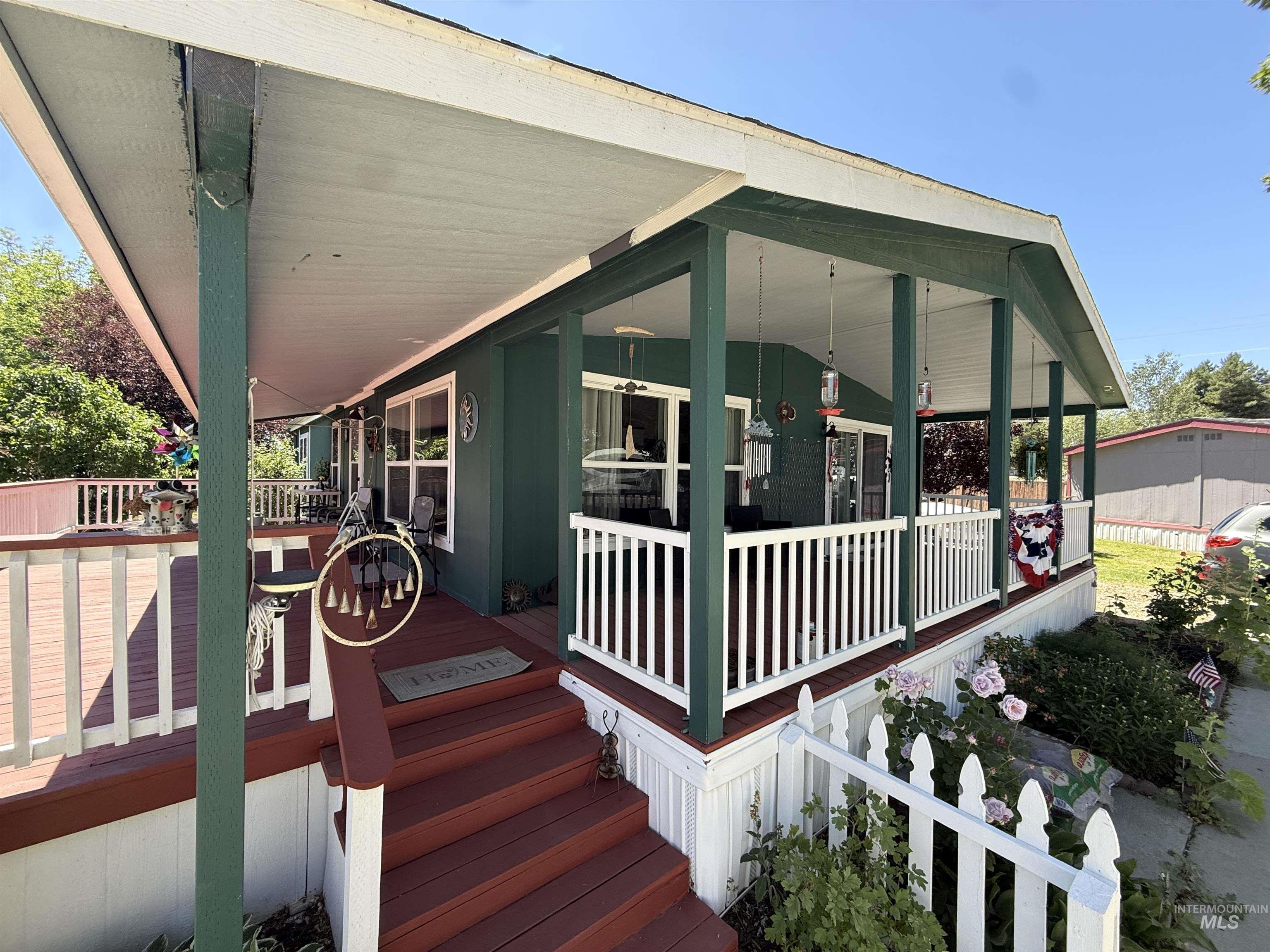 2750 Alden Road, Unit 12 12 Fruitland, ID 83619 - Photo 4 of 38 Expansive covered porch with wood-finish decking and white railing system