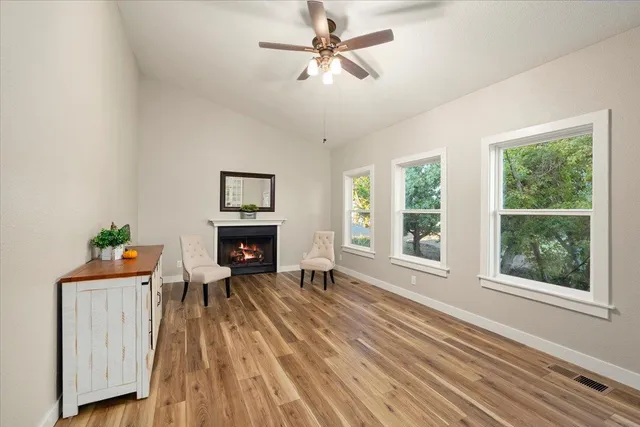 a bathroom with a granite countertop sink a mirror and a shower