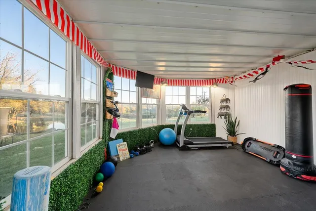 a living room with furniture a dining table and kitchen view