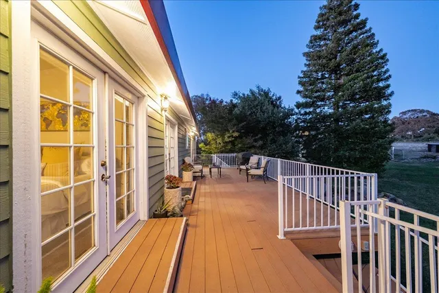 a kitchen with granite countertop cabinets a sink a window and stainless steel appliances