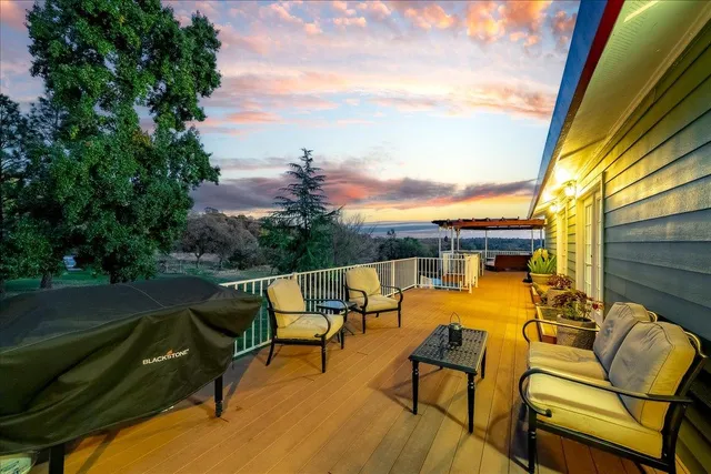 a view of balcony with deck and wooden floor