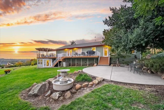 a view of swimming pool is middle in the garden