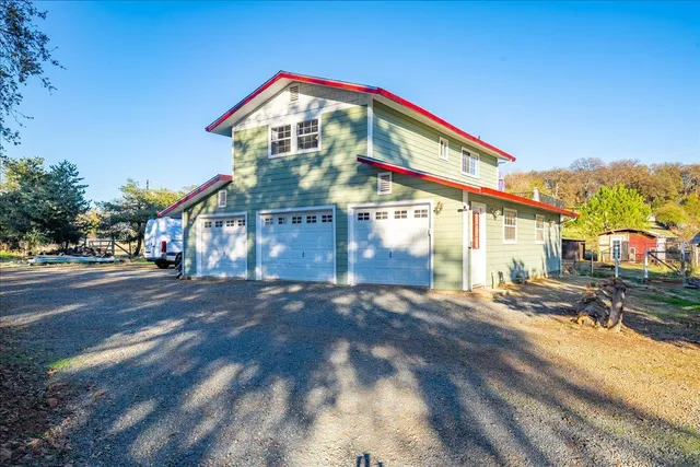 a view of yard with swimming pool and green space