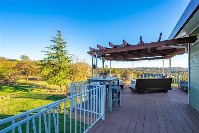 an aerial view of residential building with outdoor space and ocean view