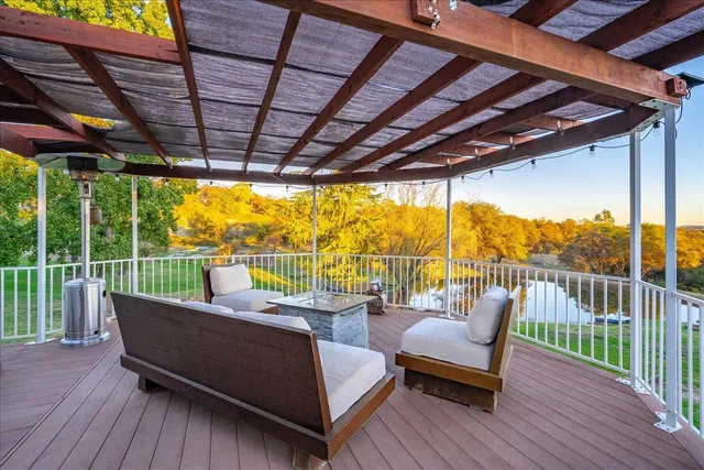 an aerial view of residential houses with outdoor space and river
