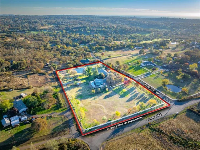 a dining room with a table chairs and kitchen view