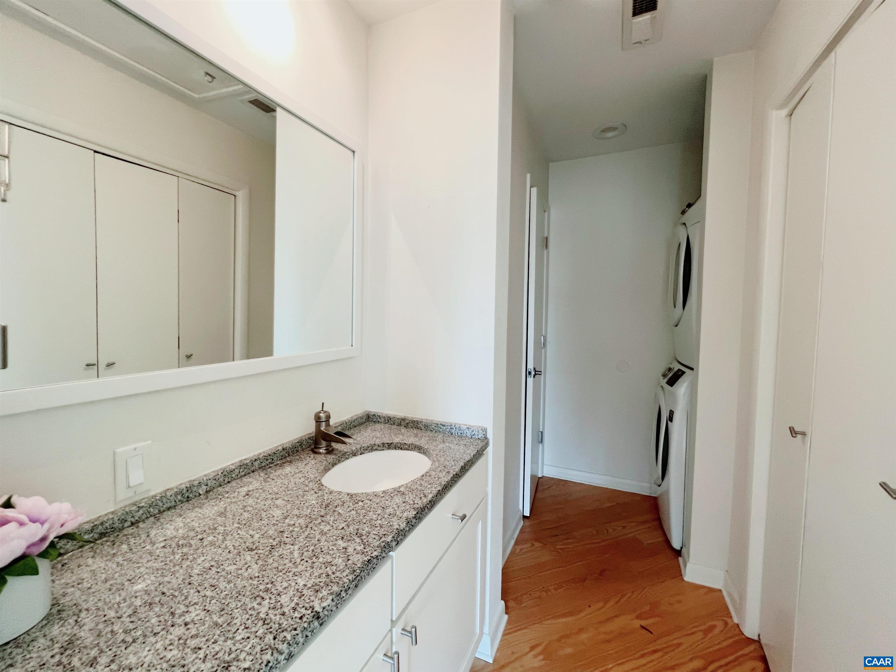 1238 Chatham Ridge Charlottesville, VA 22901 - Photo 16 of 19 a en suite bathroom with a granite countertop sink and a mirror