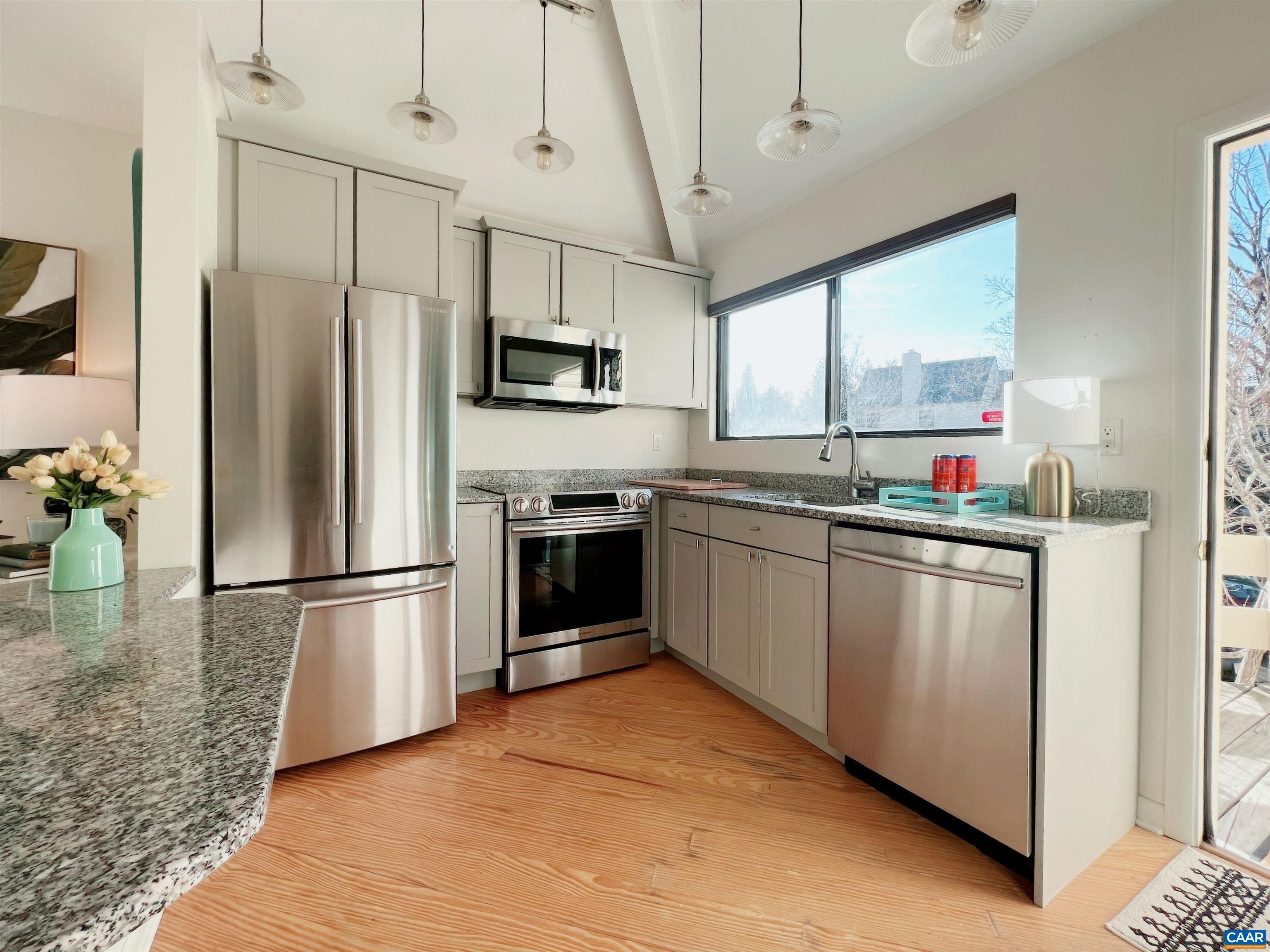 1238 Chatham Ridge Charlottesville, VA 22901 - Photo 4 of 19 a kitchen with stainless steel appliances a refrigerator sink and microwave