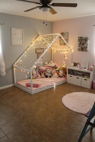 a room with furniture a rug and a chandelier