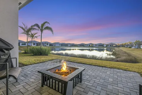 a view of swimming pool with outdoor space and lake view