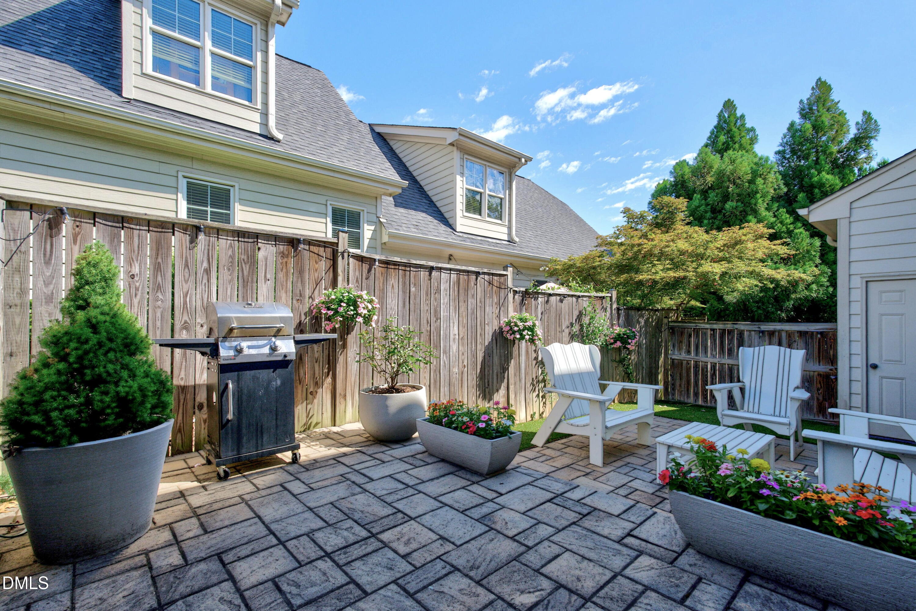 2745 Oberlin Road, Unit 103 Raleigh, NC 27608 - Photo 8 of 23 a view of a patio with plants and chairs
