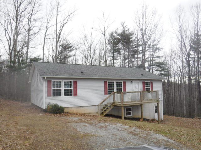 870 Kings Store Road Northeast Check, VA 24072 - Photo 1 of 18 a view of a house with a yard and garage