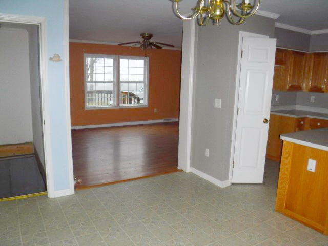 870 Kings Store Road Northeast Check, VA 24072 - Photo 2 of 18 an empty room with windows