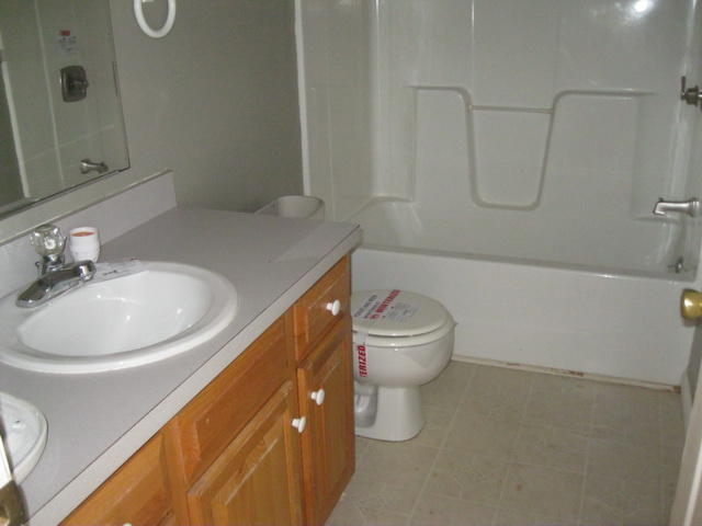 870 Kings Store Road Northeast Check, VA 24072 - Photo 15 of 18 a bathroom with a sink a toilet and shower