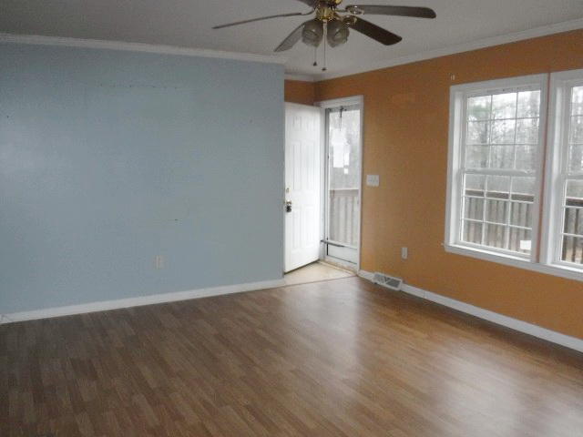 870 Kings Store Road Northeast Check, VA 24072 - Photo 4 of 18 wooden floor in an empty room with a window