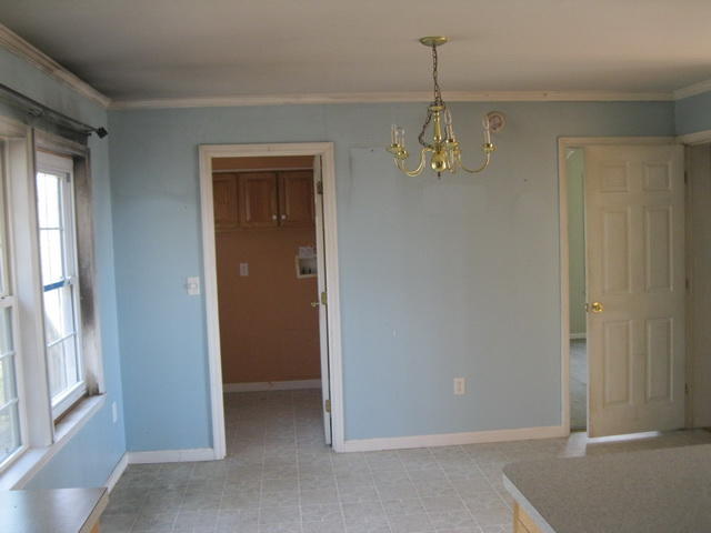 870 Kings Store Road Northeast Check, VA 24072 - Photo 8 of 18 a view of a hallway with windows and chandelier