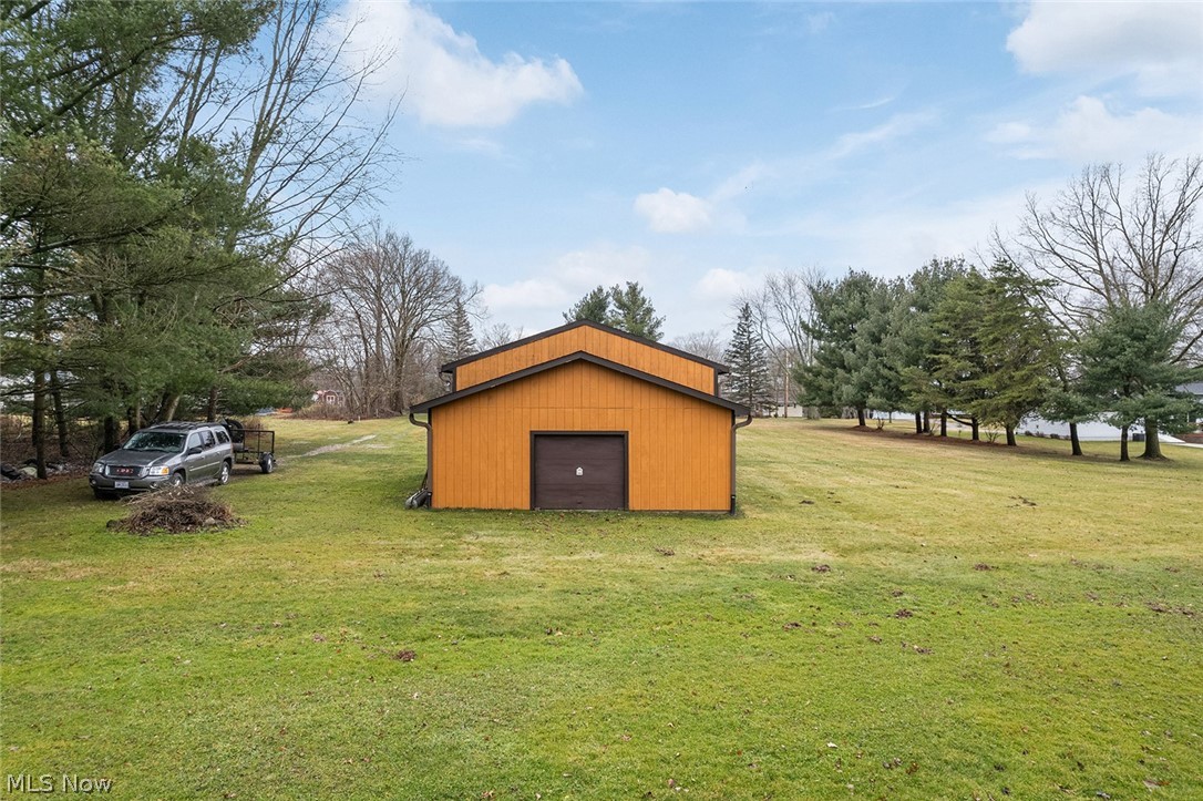 12640 Doylestown Road Rittman, OH 44270 - Photo 28 of 35 View of shed / structure with a lawn and a garage