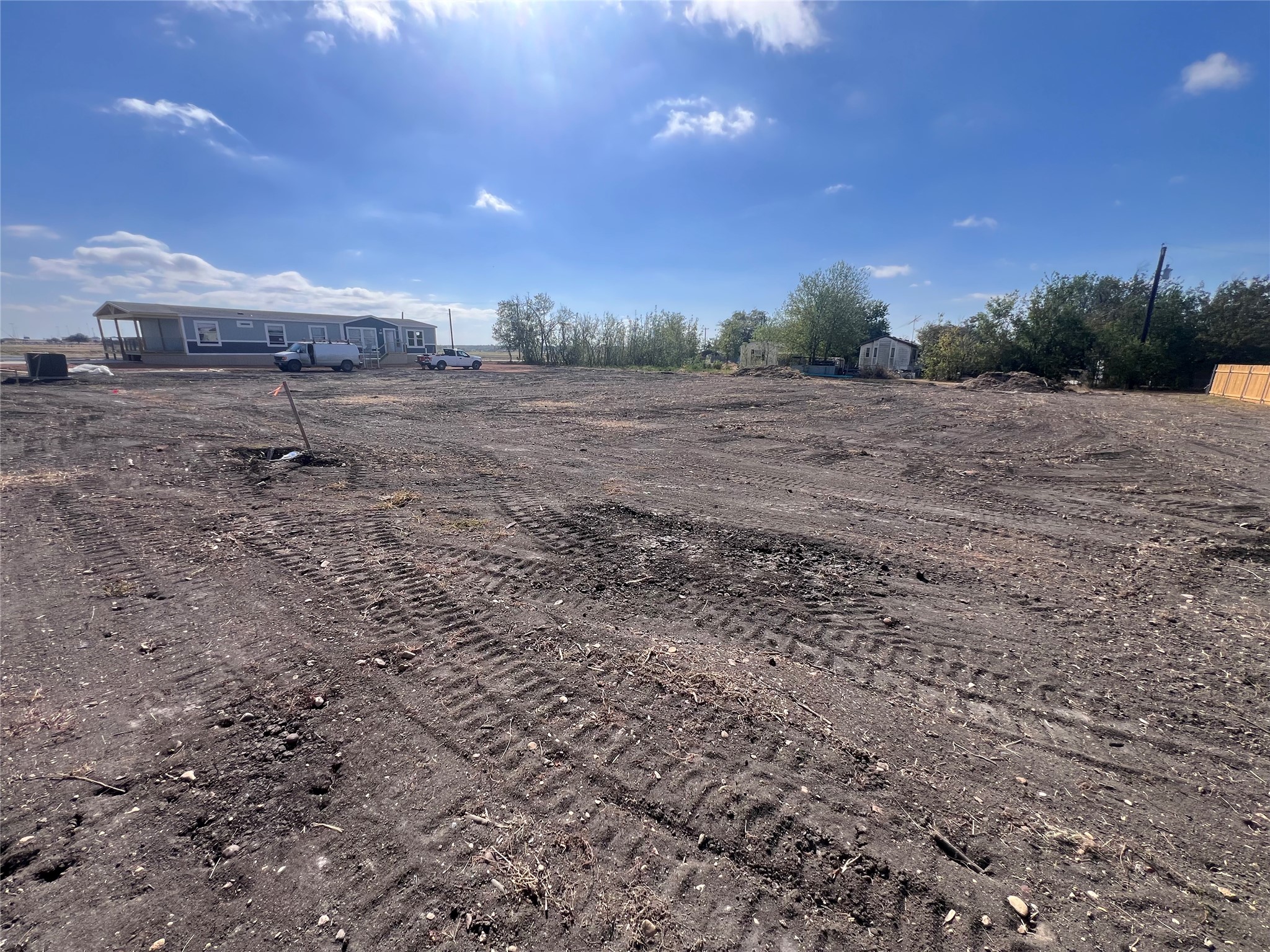 706 East Pecan Granger, TX 76530 - Photo 9 of 10 a view of a dry yard with trees