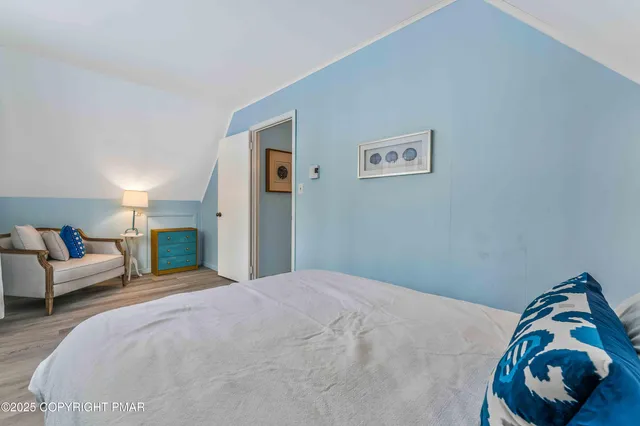 a bedroom with a bed and a couch