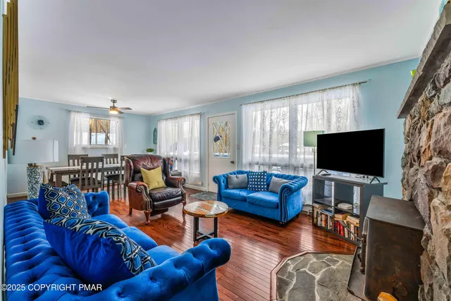a living room with furniture and a flat screen tv