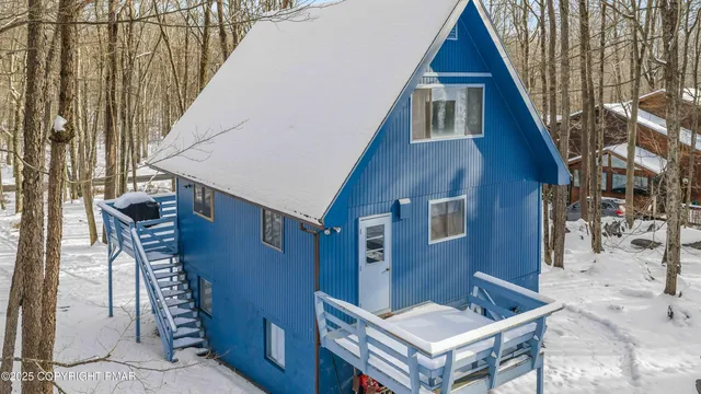 a view of house with outdoor space and shower