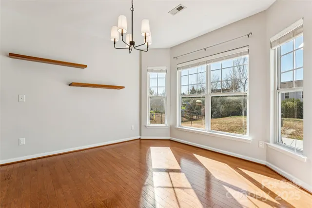 a kitchen with a stove sink and a mirror