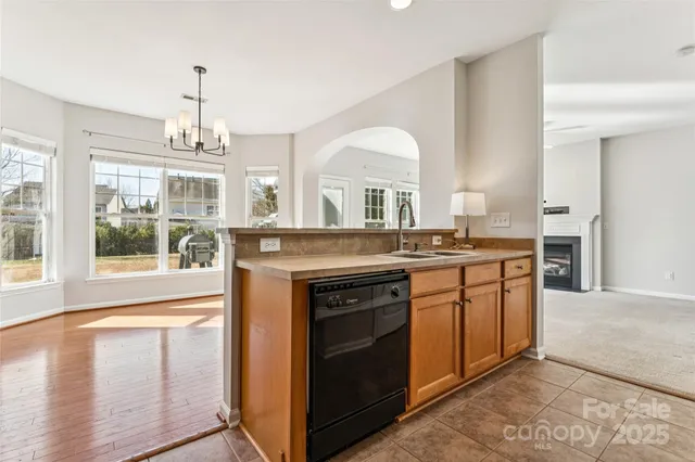 a bathroom with a tub a double vanity sink and mirror