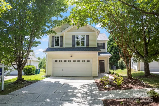 a view of staircase with white walls and windows