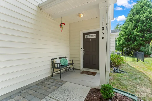 a living room with furniture ceiling fan and a window