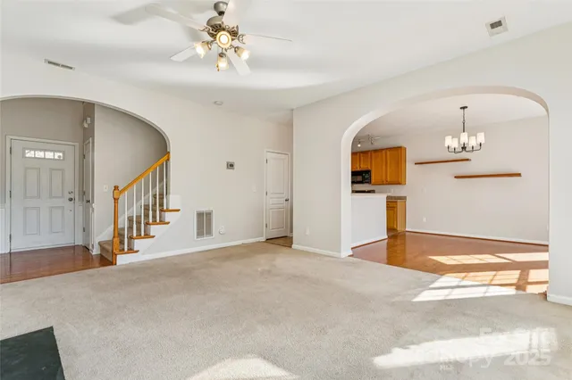 a view of kitchen with microwave and refrigerator