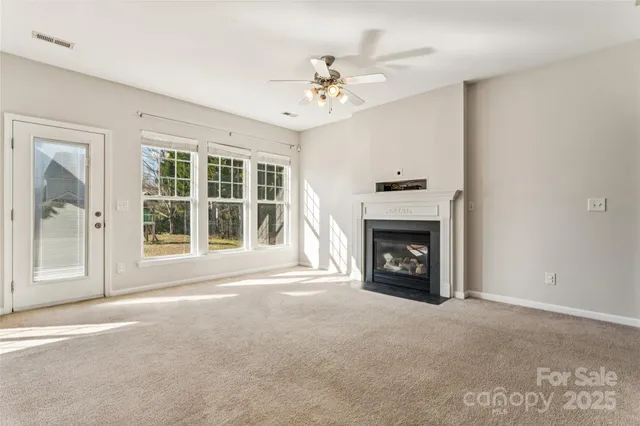 a kitchen with stainless steel appliances a sink stove and microwave