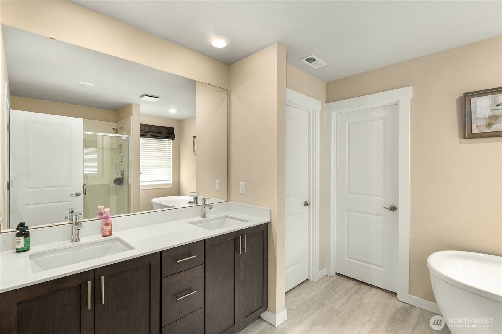 19410 28th Drive Southeast Bothell, WA 98012 - Photo 32 of 37 a bathroom with a double vanity sink toilet and shower