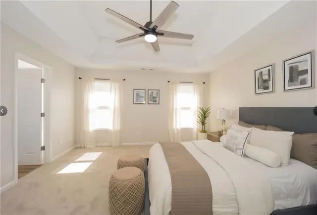 a bedroom with a large bed and a window