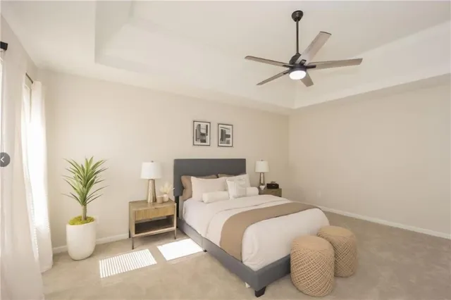 a bedroom with bed and a potted plant