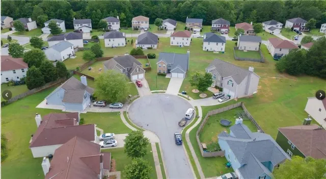 an aerial view of a house with outdoor space
