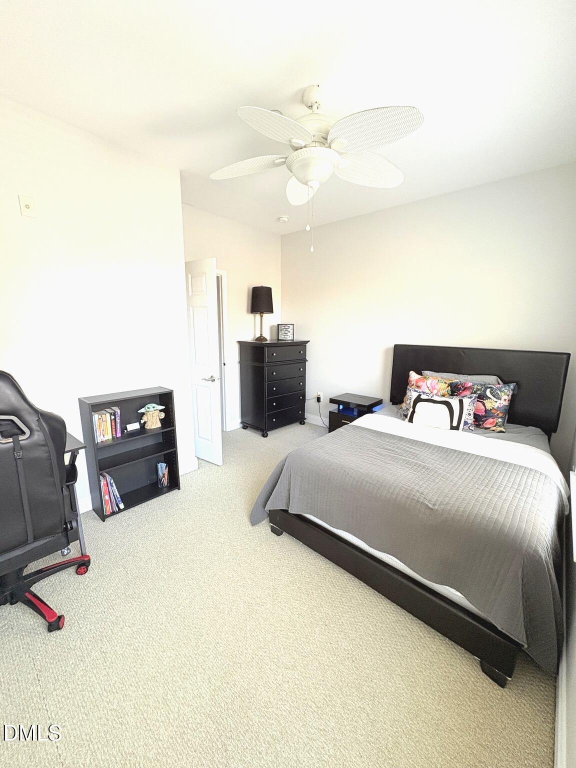 9211 Calabria Drive, Unit 117 Raleigh, NC 27617 - Photo 12 of 19 a bedroom with a bed and two night stand