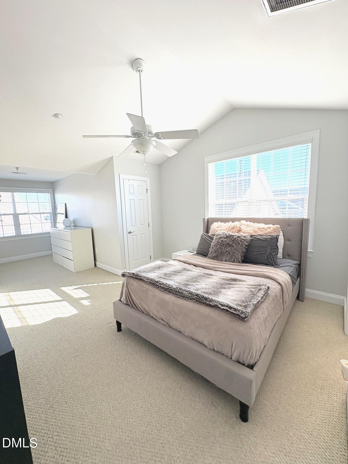 9211 Calabria Drive, Unit 117 Raleigh, NC 27617 - Photo 14 of 19 a bedroom with bed and window
