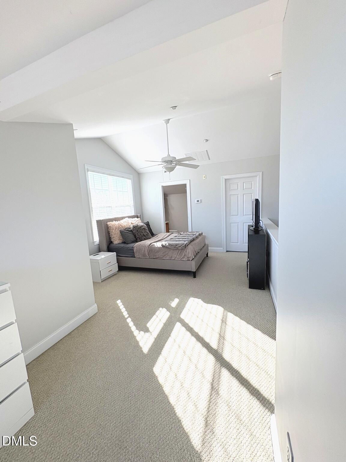 9211 Calabria Drive, Unit 117 Raleigh, NC 27617 - Photo 16 of 19 a bedroom with a bed and gym equipment