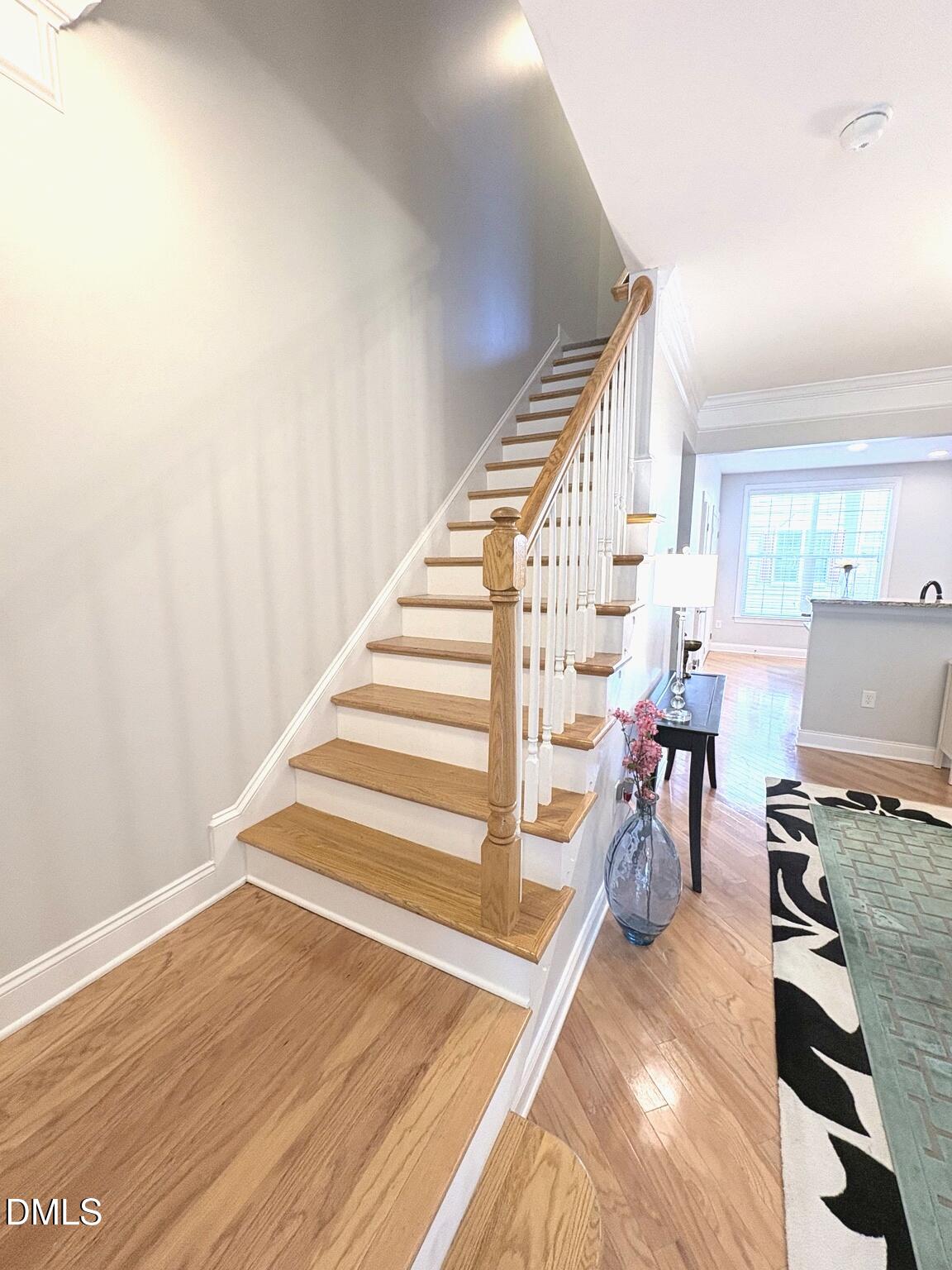 9211 Calabria Drive, Unit 117 Raleigh, NC 27617 - Photo 8 of 19 a view of a room with wooden floor and chair