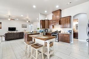 25280 Grove Way Madera, CA 93638 - Photo 14 of 32 a kitchen with a sink cabinets and stainless steel appliances