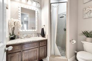 25280 Grove Way Madera, CA 93638 - Photo 19 of 32 a bathroom with a granite countertop sink toilet and shower