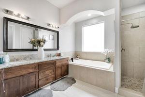 25280 Grove Way Madera, CA 93638 - Photo 25 of 32 a bathroom with a tub a sink and mirror