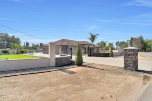 25280 Grove Way Madera, CA 93638 - Photo 30 of 32 a view of a house with a yard and a large pool