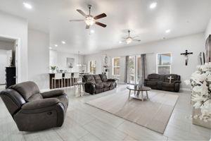 25280 Grove Way Madera, CA 93638 - Photo 6 of 32 a living room with furniture a couch and a chandelier