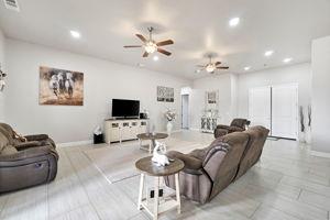 25280 Grove Way Madera, CA 93638 - Photo 8 of 32 a living room with furniture and a flat screen tv