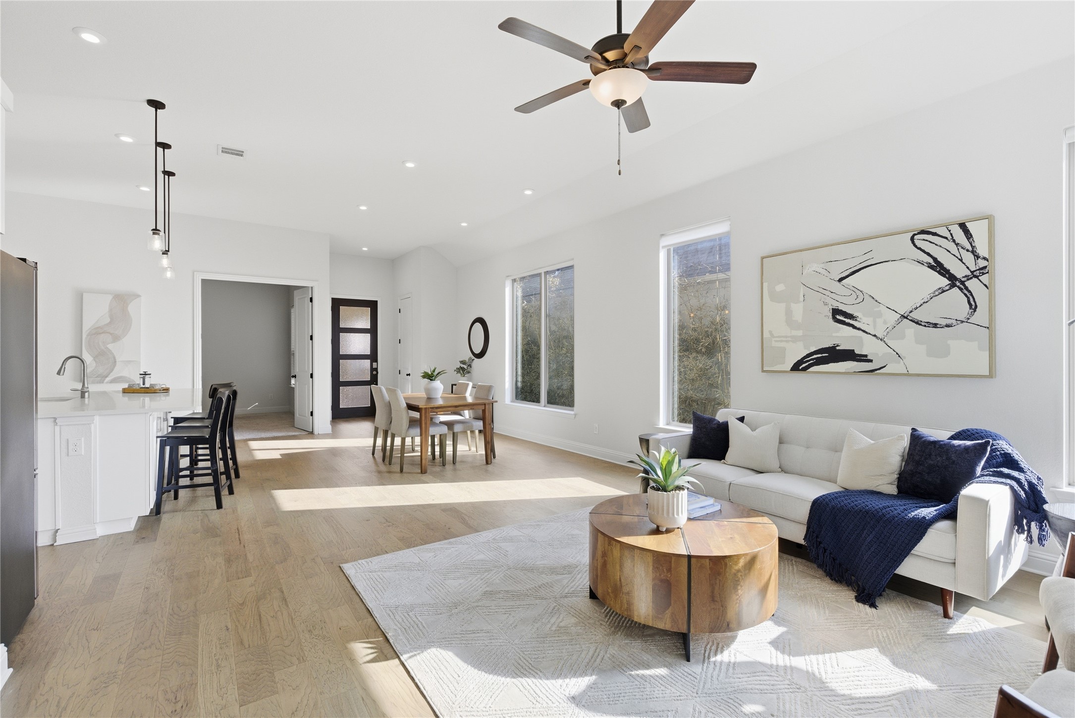 225 Diamondback Drive Georgetown, TX 78628 - Photo 15 of 40 Living area with light wood-style floors, ceiling fan, and recessed lighting.