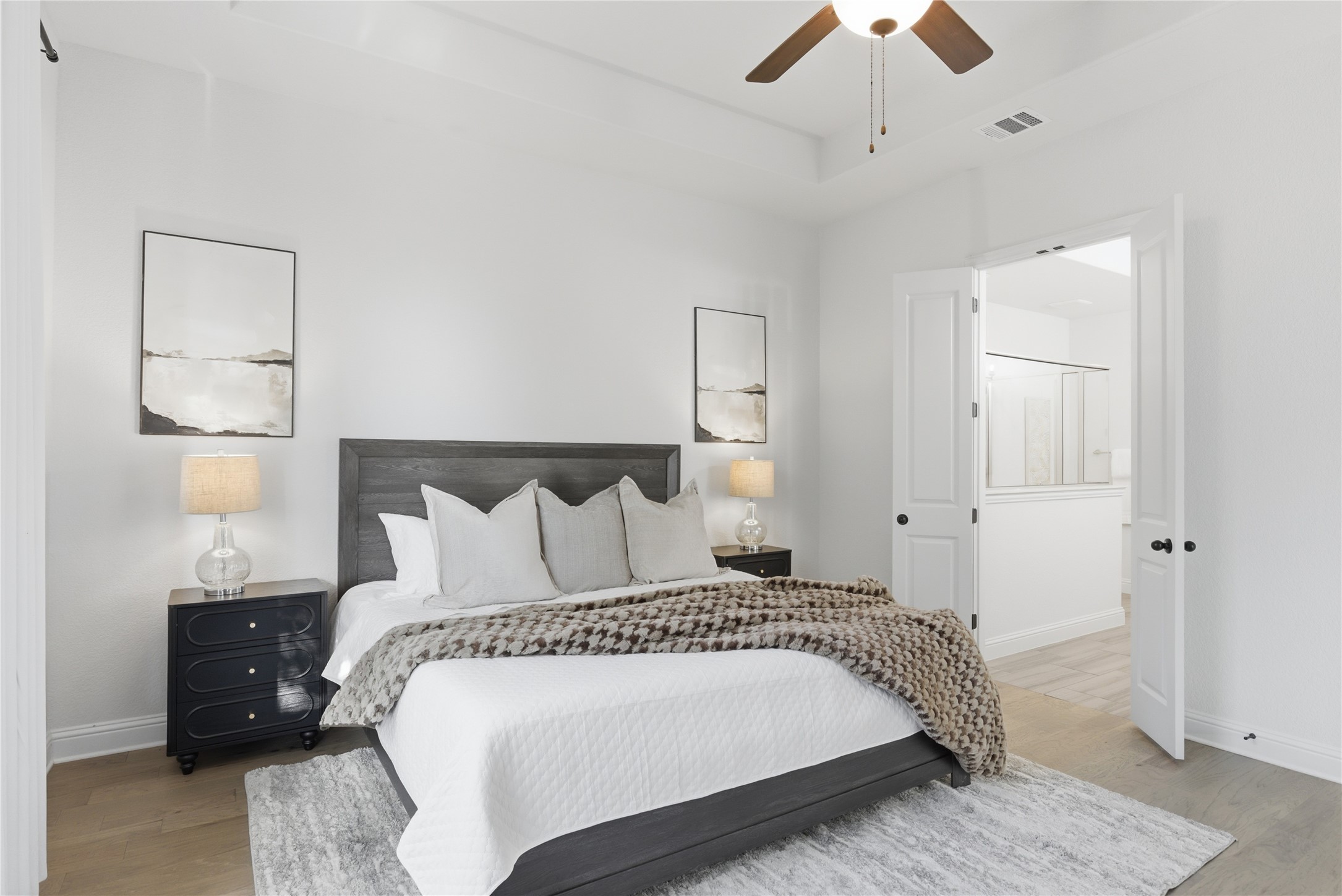 225 Diamondback Drive Georgetown, TX 78628 - Photo 18 of 39 Bedroom with light wood-style flooring and ceiling fan.